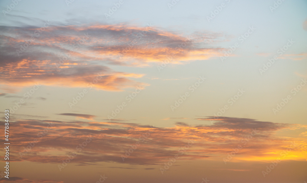 Pastel colors clouds on sunset background
