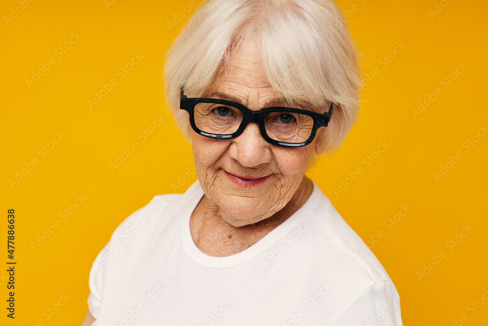 Portrait of an old friendly woman health lifestyle eyeglasses isolated background