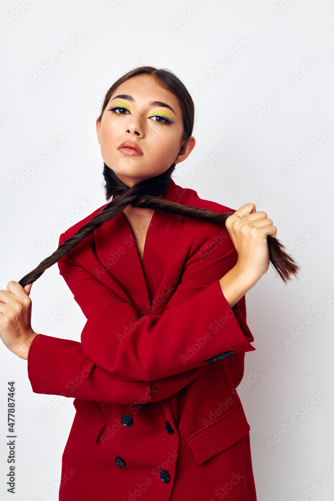 attractive girl bright makeup red jacket posing light background unaltered attractive girl bright makeup red jacket posing light background unaltered