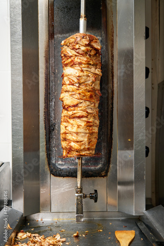 kebab meat is cooked on a skewer