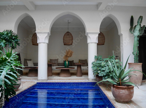 Marrakech, Morocco, 24.10.2021. Courtyard with pool and lounge area at a traditional riad.