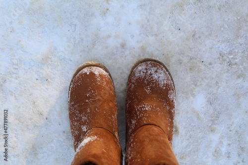 close-up of warm boots, ugg boots in the snow photo