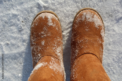 close-up of warm boots, ugg boots in the snow