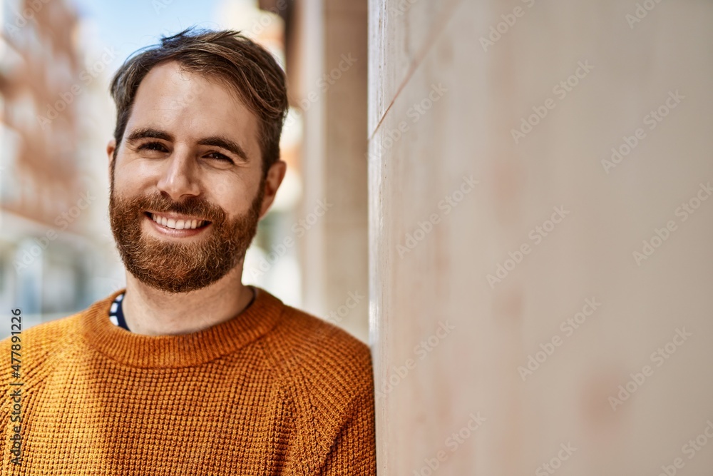 Young caucasian man with beard outdoors on a sunny day Young caucasian man with beard outdoors on a sunny day