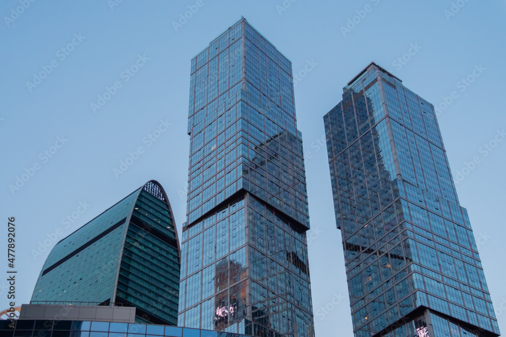 Modern tall office buildings, luxury apartments, glass skyscrapers at city downtown against evening sky. Moscow International Business Center. Architecture, corporate, financial and cityscape concept