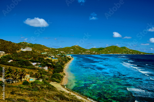 View of the ocean with colorful reefs and sand