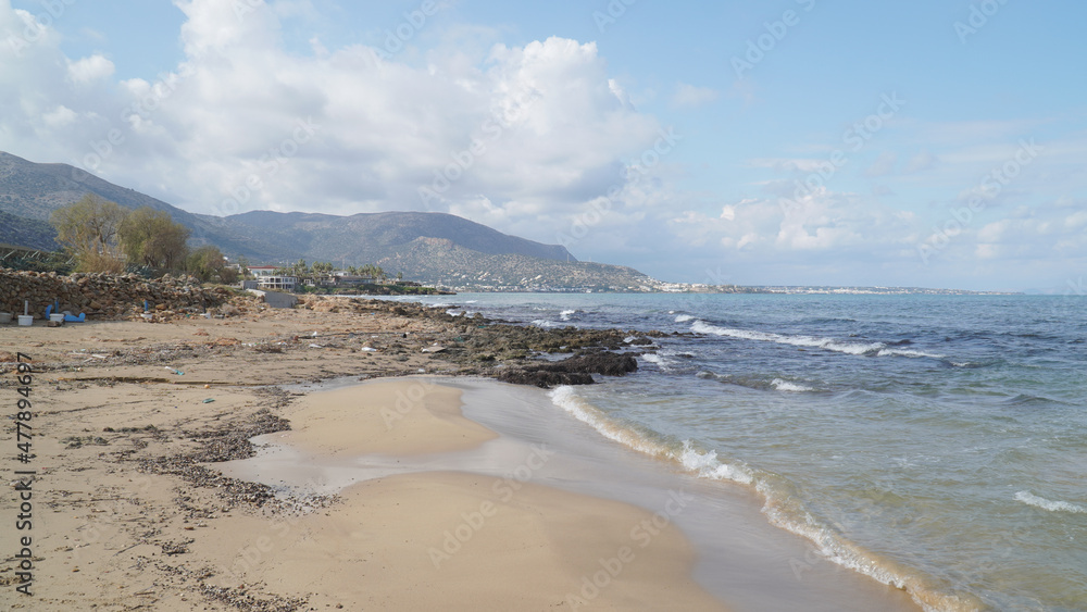 Sandy beach on a sunny day in Malia, Crete Island of Greece.