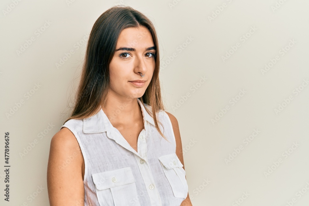 Beautiful young woman standing confident looking at the camera Beautiful young woman standing confident looking at the camera