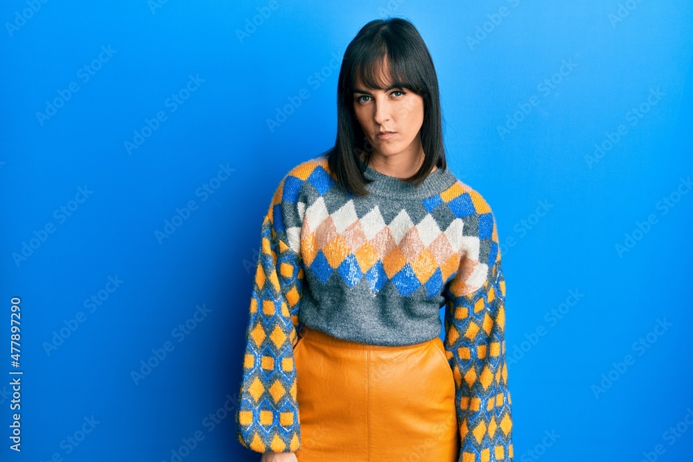 Young hispanic woman wearing casual winter sweater skeptic and nervous, frowning upset because of problem. negative person. Young hispanic woman wearing casual winter sweater skeptic and nervous, frowning upset because of problem. negative person.