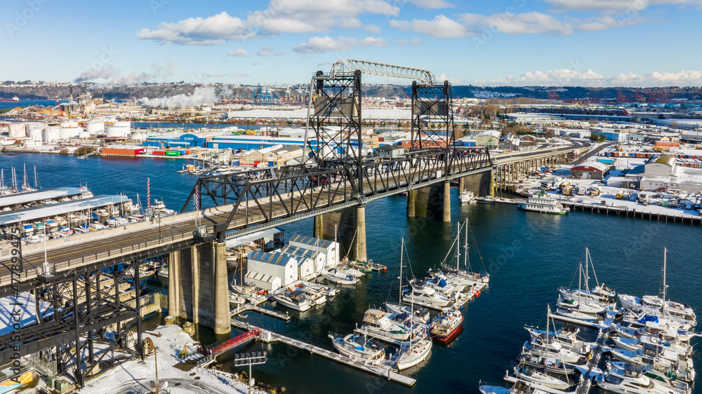 Aerial view of the Port of Tacoma Bridge with industrial buildings in the background