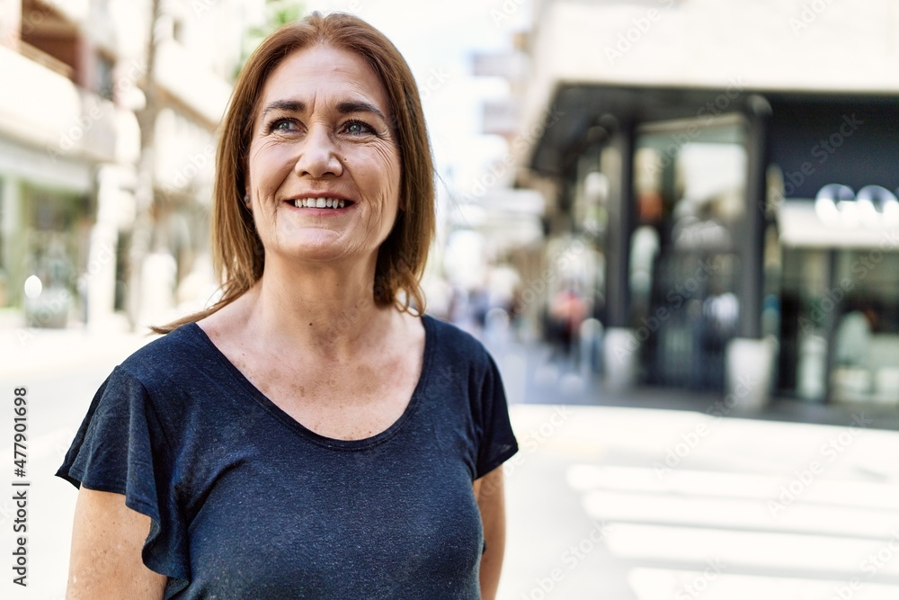 Middle age hispanic woman smiling happy outdoors on a sunny day Middle age hispanic woman smiling happy outdoors on a sunny day