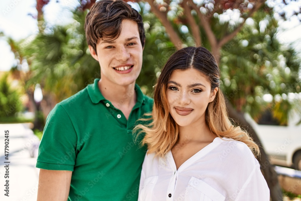 Young caucasian couple smiling happy and hugging standing at the city. Young caucasian couple smiling happy and hugging standing at the city.