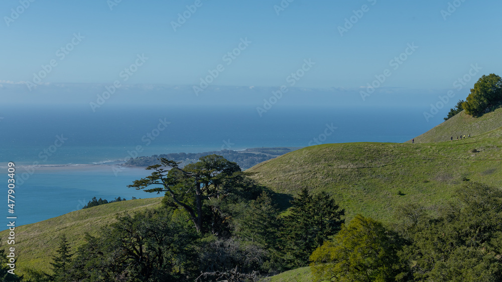 On top of the hill at Mt.Tamalpais overlooking the Pacific Ocean on a clear day hiking the hillside to see the view 