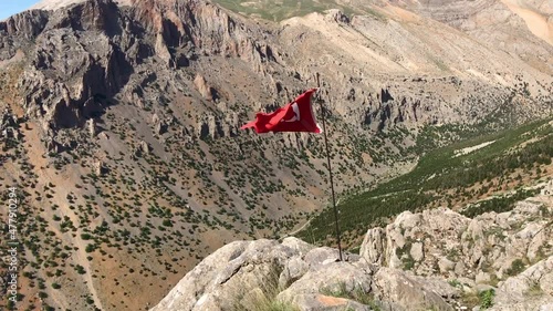 Aladaglar Kaletepe Summit with Turkish Flag in Nigde, Turkey. Aladaglar is most important mountain range in Turkey.  photo