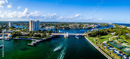 panoramic drone shot of hillsboro beach inlet, Florida with bridge in city