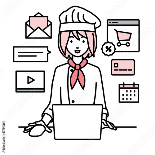 デスクで座ってPCでネットショップやマーケティングの仕事をしている調理師の女性