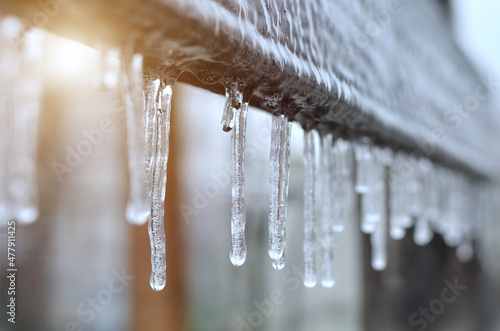Close-up of icicles after a winter ice storm. Effect of atmospheric icing.