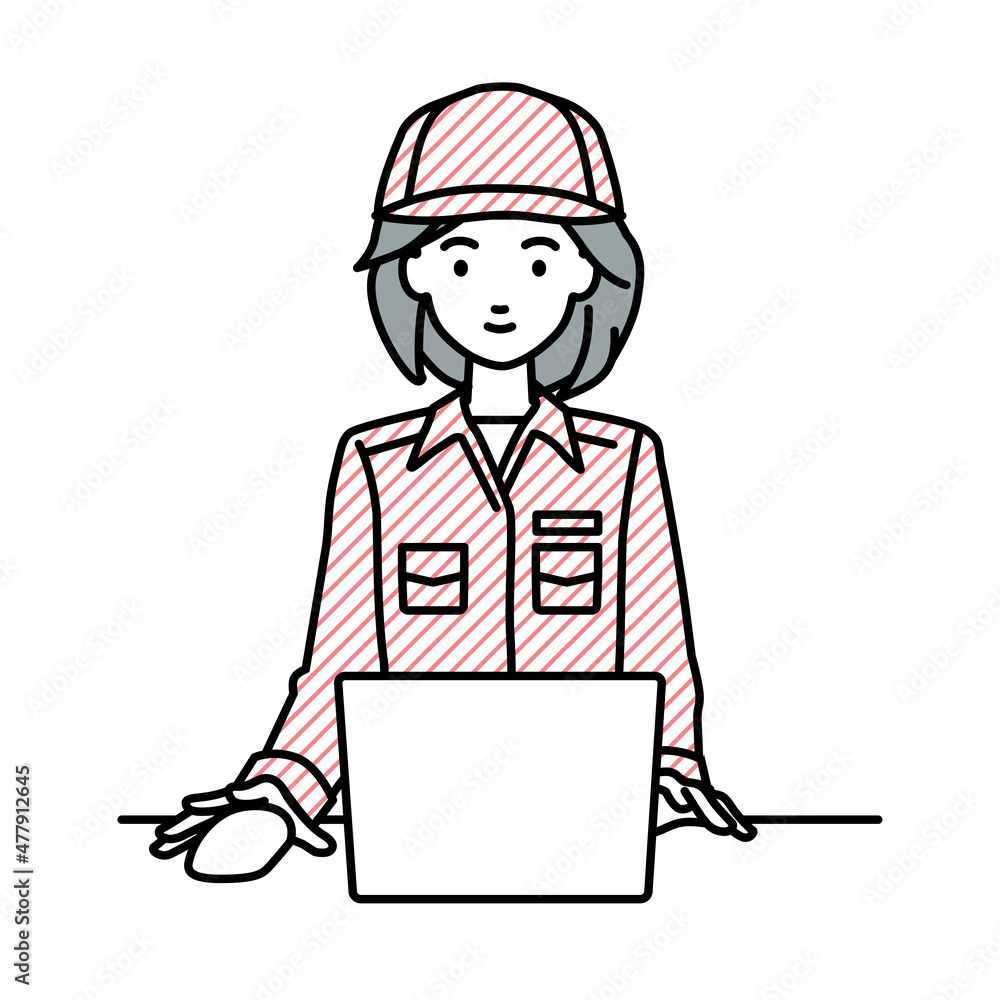 デスクで座ってPCを使っている作業員の女性 デスクで座ってPCを使っている作業員の女性