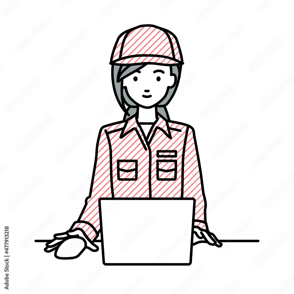 デスクで座ってPCを使っている作業員の女性