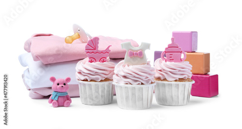 Beautifully decorated baby shower cupcakes for girl  clothes and toys on white background