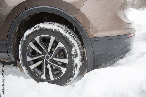 Car stuck is in a snowdrift in winter