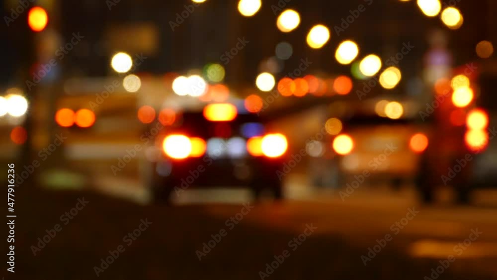 Blurred cars driving at night, unfocused traffic lights , video footage Blurred cars driving at night, unfocused traffic lights , video footage