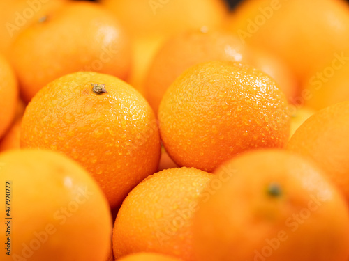 Tangerines. Close-up of few beautiful fresh tangerine fruit with water drops