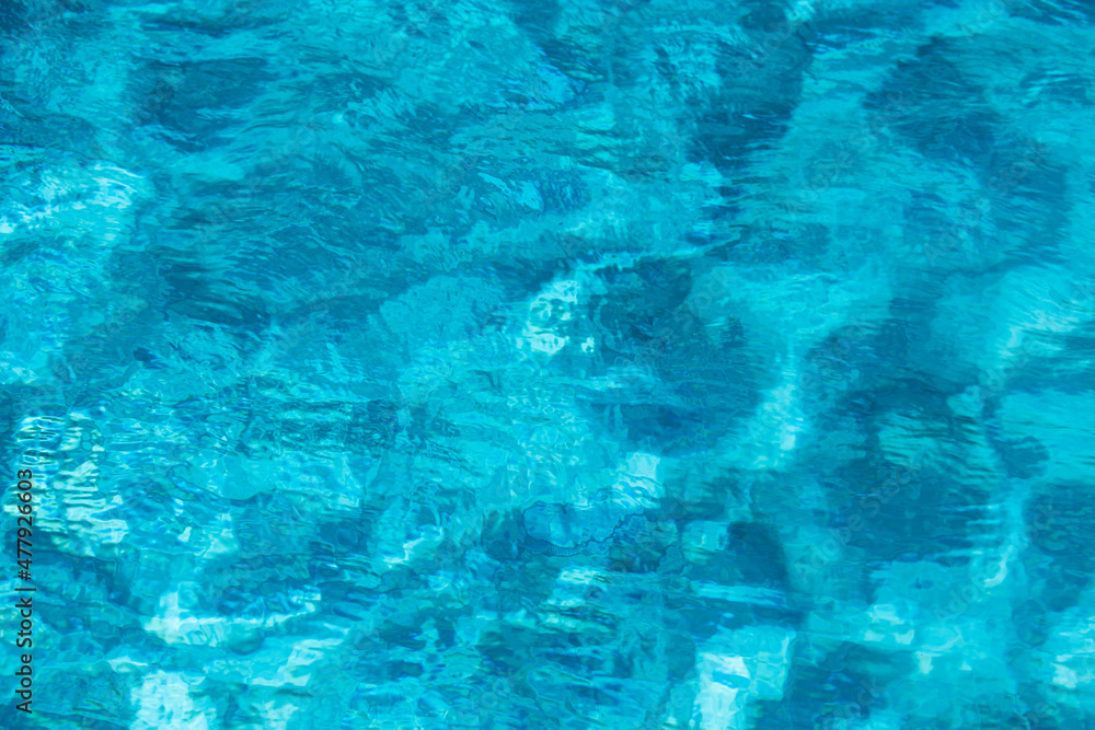 Abstract ripple wave and clear turquoise water surface in swimming pool, blue water wave for background and abstract design. Abstract ripple wave and clear turquoise water surface in swimming pool, blue water wave for background and abstract design.
