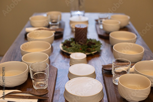 Korea Empty white ceramic bowls on wooden table background.