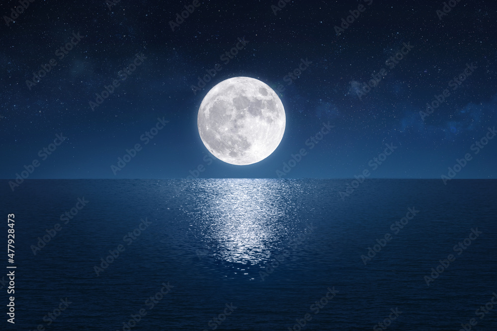 Full moon over the peaceful sea (Elements of the moon image furnished by NASA)