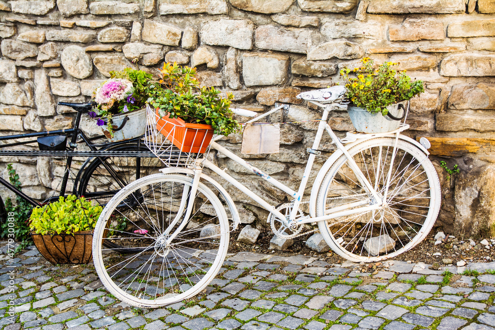 Beautiful And Famous Street Decorated With Old Bikes With Flower Baskets. Sighișoara, Romania. Europe. Travel Concept. Summer Day