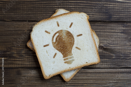 toast with a sign new idea on dark wood.