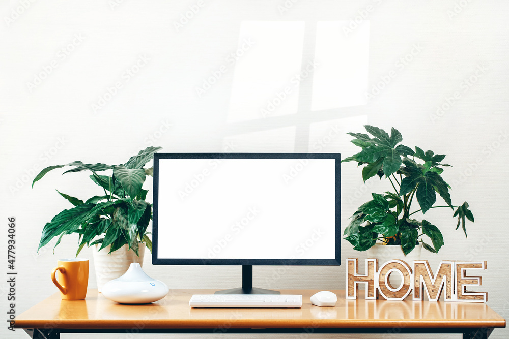 Front view of workspace with modern computer wireless headphones and ...