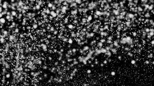 White Snow Falling on Isolated Black Background