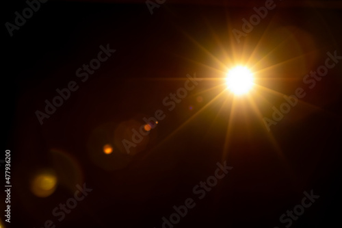 Fototapet Sun flare on the black background