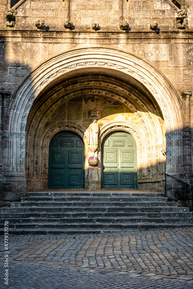 Close up detail of the facade of the church of Saint Ronan in Locronan. Doorway