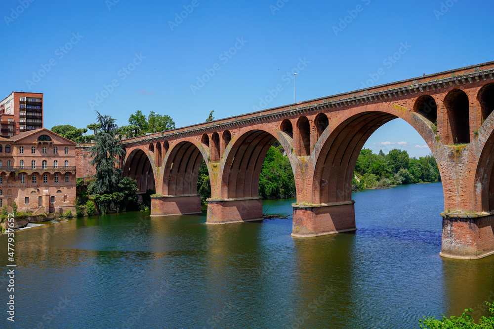 Albi old red brick stone bridge over Tarn river in France