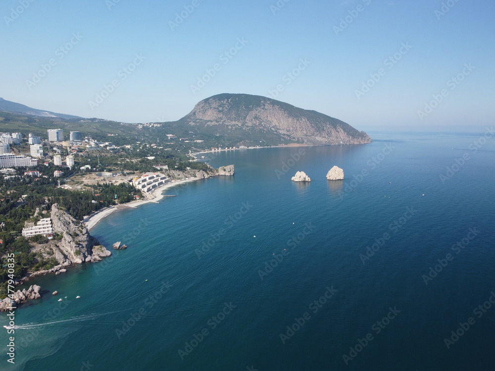GURZUF, CRIMEA - Aerial Panoramic view on Gurzuf bay with Bear mountain Ayu-Dag and rocks Adalary, Artek - oldest children vacation camp. Yalta region, the South coast of Crimea peninsula