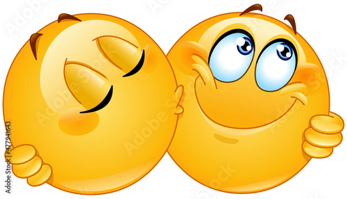 Two emoji emoticons kissing on the cheek and hugging