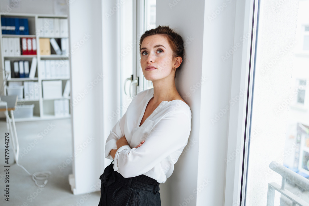 custom made wallpaper toronto digitalSerious young businesswoman standing deep in thought