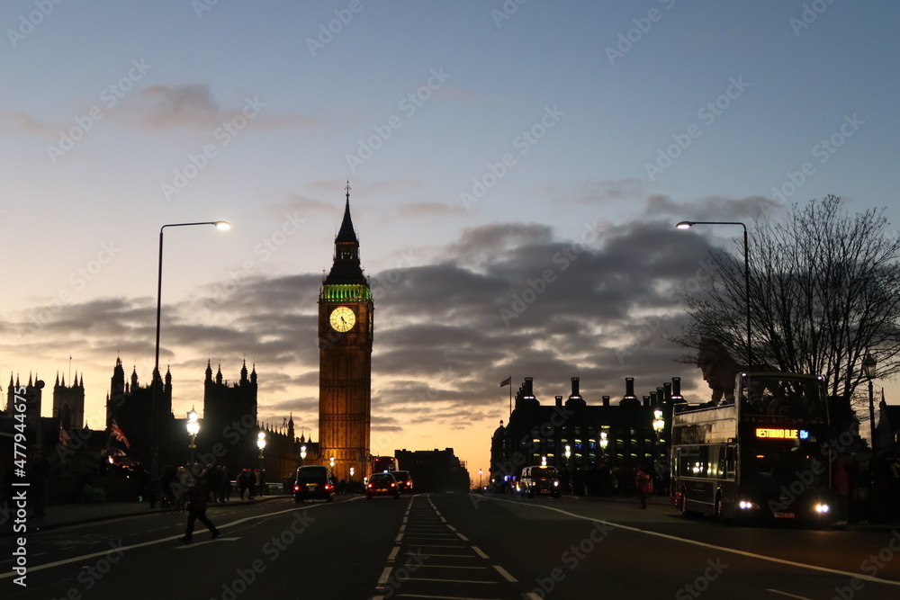 The Westminster Palace and Big Ben clock tower, major tourist attraction and Parliament in London just after sunset.