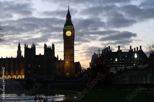 The Westminster Palace and Big Ben clock tower  major tourist attraction and Parliament in London just after sunset.