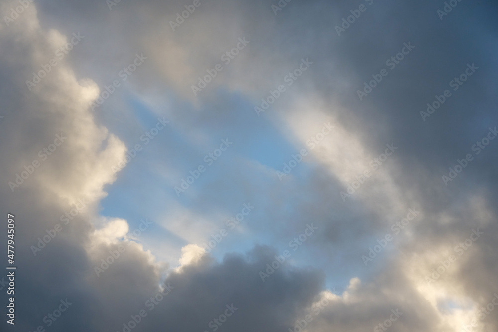 Calm blue and white cloudy sky. Background for design.