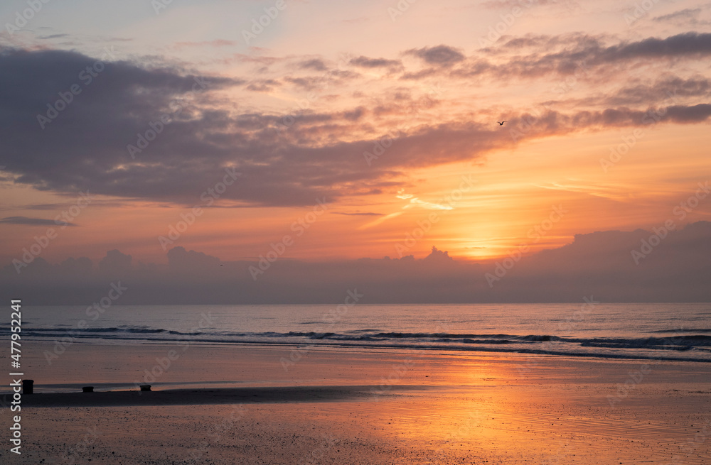 December sunrise at low tide on Bexhill beach East Sussex, south east England