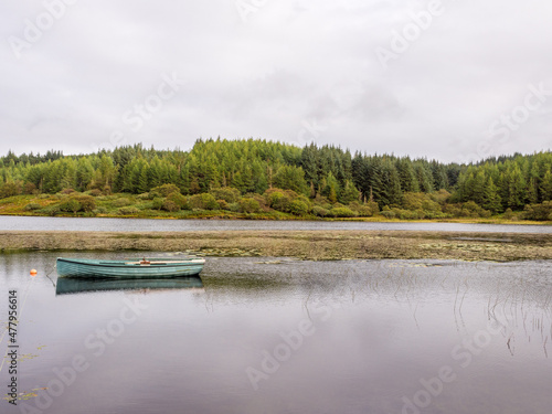 Fishing boat on the beautiful small Loch Fina, Isle of Mull, Scotland, UK