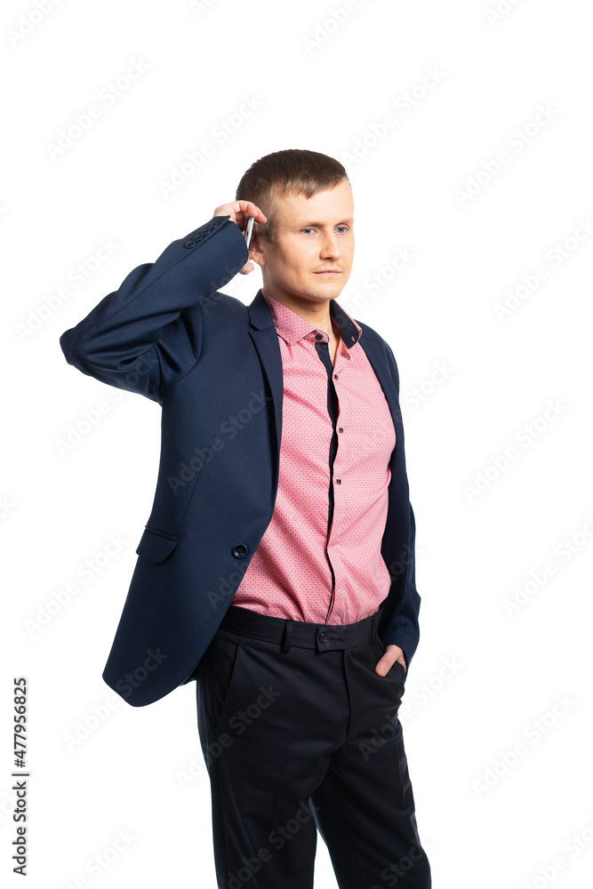 businessman, businessman holds a phone in his hand and looks into it. young man in a business suit takes an important call. isolated businessman, businessman holds a phone in his hand and looks into it. young man in a business suit takes an important call. isolated
