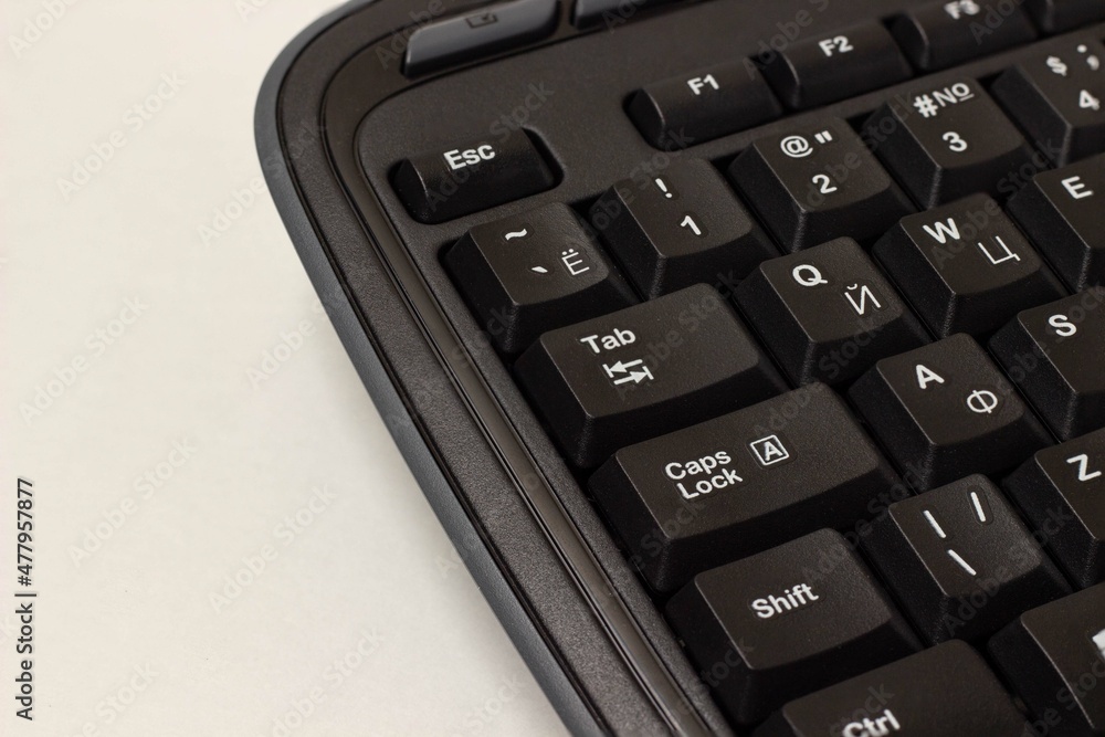 computer keyboard on white background with english and russian layout computer keyboard on white background with english and russian layout