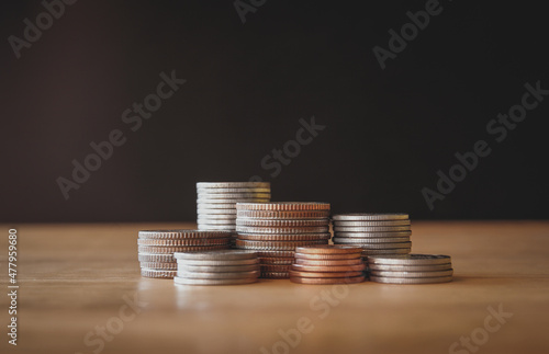 Stacks of money coin on wooden desk, Business and Finance concept. 