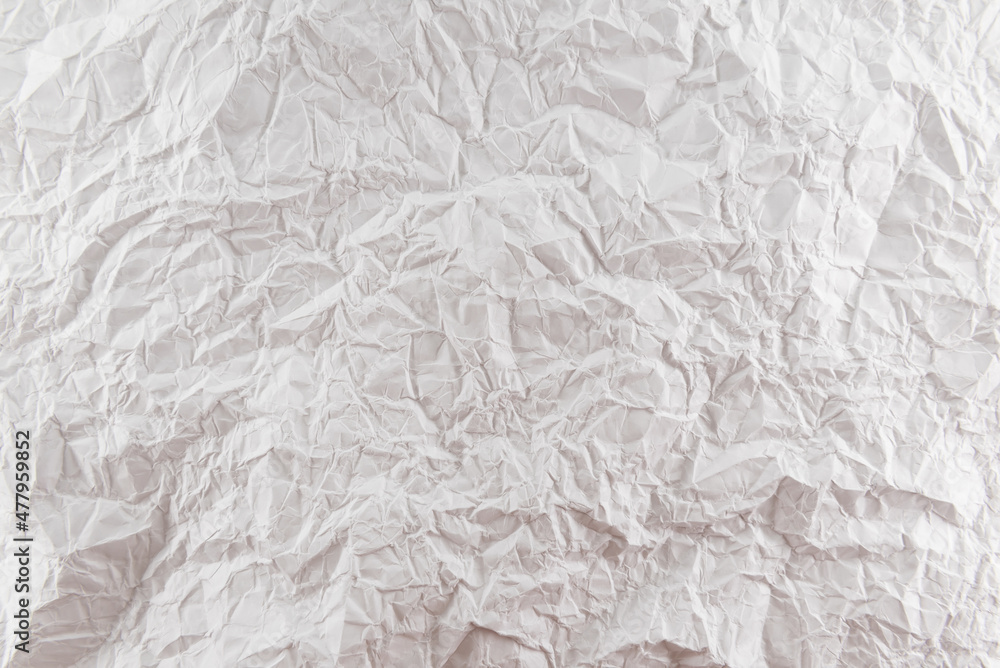 Background from crumpled white paper close-up. Pleated paper Background from crumpled white paper close-up. Pleated paper