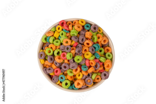 Colorful rings cereal spill out into a bowl. Breakfast. Isolated.